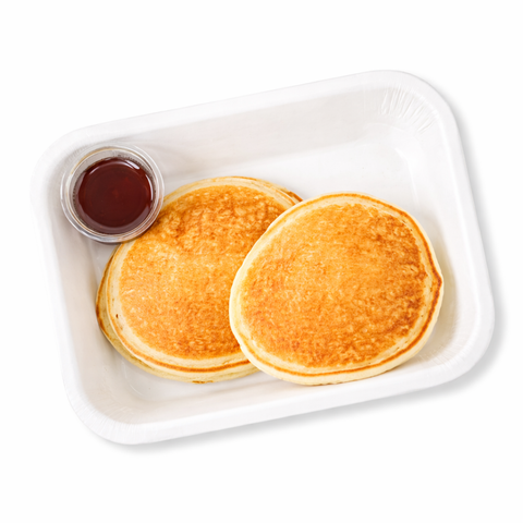Two pancakes with syrup on a white plate